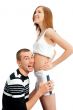 Cheerful man listening the belly of his pregnant wife