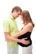 Image of pregnant woman touching her belly with hands