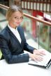 Portrait of a pretty businesswoman sitting at cafe with a laptop