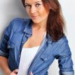 Portrait of a beautiful young woman wearing a denim shirt, tuggi