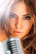 Trendy Singer Girl Singing In Retro Mic