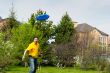 Man playing frisbee at his backyard