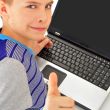 Portrait of a cute little boy using a laptop