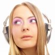 Beautiful woman with headphones, she is listening to the music