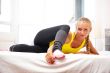 Portrait of beautiful young woman doing exercise at her home
