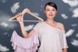 Portrait of pretty fashionable woman trying new clothes. Fashion