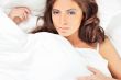 Fashion portrait of young elegant woman in bed