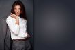 Portrait of a beautiful young business woman standing with hand 