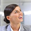 Closeup portrait of cute young business woman smiling