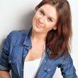 Portrait of a beautiful young woman wearing a denim shirt, tuggi