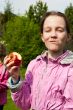 Portrait of happy girl with apple