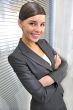 A portrait of a young business woman in an office