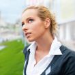 Closeup portrait of a beautiful woman in the city at summer time