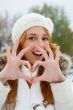 Portrait of beautiful young red hair woman outdoors in winter lo