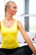 Portrait of beautiful young woman resting after doing exercise a