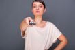 Portrait of a beautiful fashionable elegant woman with remote co