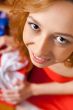 Christmas woman near a Christmas tree holding big gift box while