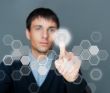 Business Man pressing digital button, futuristic technology