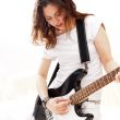 Portrait of young pretty girl who is feeling free and playing gu