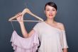 Portrait of pretty fashionable woman trying new clothes. Fashion
