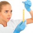 Isolated scientist woman in lab coat with chemical glassware. 