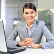 Beautiful business woman thinking about somethinking while worki