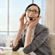 Portrait of a beautiful young businesswoman on the phone and hap
