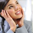 Closeup portrait of cute young business woman smiling and daydre