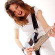 Portrait of beautiful young and attractive womanplaying her guit