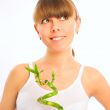 Portrait of young beautiful woman with bamboo looking away