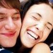 Young man meeting his girlfriend with opened arms at airport arr