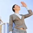 Portrait of a beautiful young businesswoman outside.