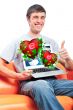 Portrait of young man thumbs up and showing display of his lapto