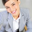 Closeup portrait of cute young business woman smiling