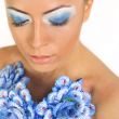 Gorgeous woman with blue flower dress over white background