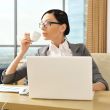Portrait of a beautiful young businesswoman drinking water.