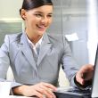 Young business woman on a laptop at her office