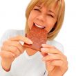 Closeup portrait of a beautiful adult woman holding big chocolat