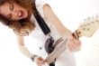 Portrait of beautiful young and attractive womanplaying her guit