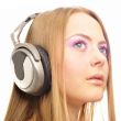 Beautiful woman with headphones, she is listening to the music