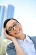 Closeup portrait of cute young business woman smiling