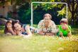 Artistic lifestyle photo of full happy family laying relaxed on 