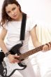 Portrait of young pretty girl who is feeling free and playing gu