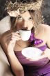 Young beautiful lady drinking coffee