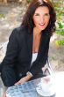 Closeup portrait of cute young business woman smiling while drin