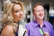 Young attractive happy couple shopping at mall. 