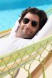 Man relaxing by the pool