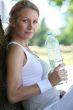 woman sat holding water bottle
