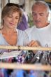 senior couple shopping for clothes