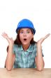 Surprised female construction worker